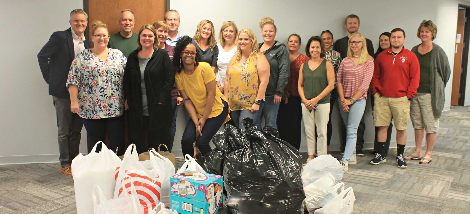 team photo in front of dontation