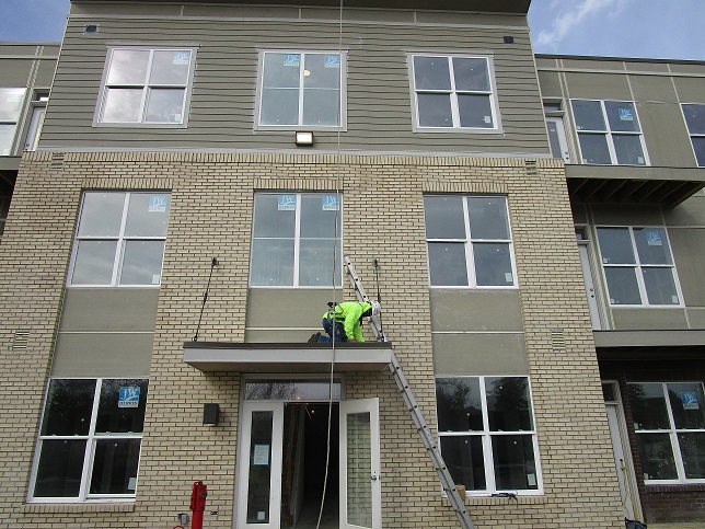 MM-Roofer utilizing a rope grab system attached to a roof anchor to assure free fall is minimized