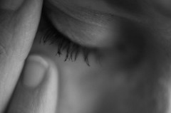Black and White Photo of Woman in Pain with a Tension Migraine