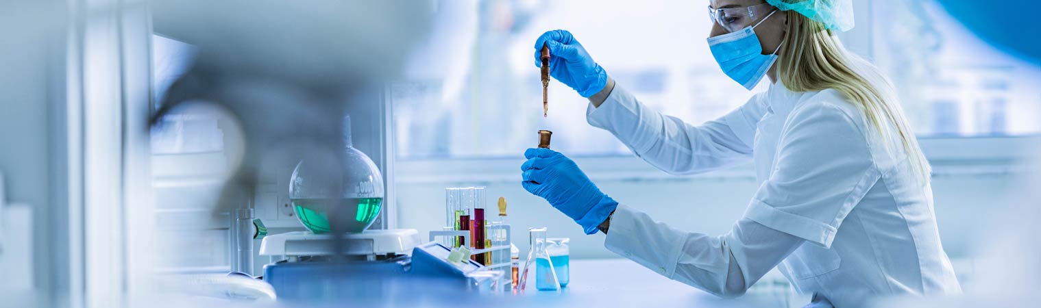 lab tech using test tube samples