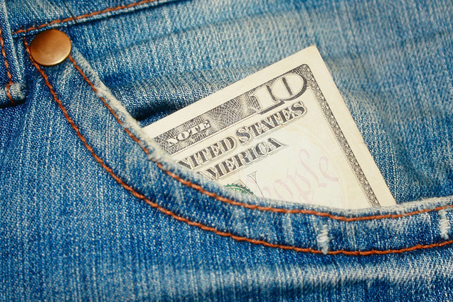 Ten dollar bill in a person's pants pocket