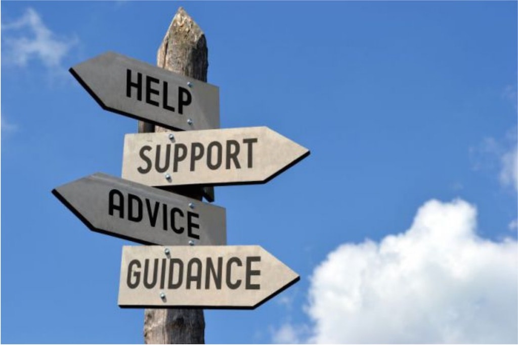 Signs pointing in different directions for help, support, advice and guidance