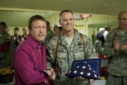 Chef Carroll received the American flag from the General during his first Operation: HOT in Afghanistan in 2011