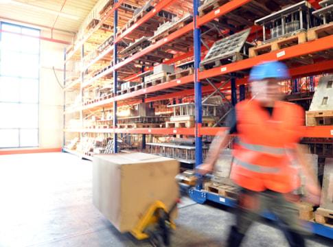 workers-in-warehouse-with-forklift